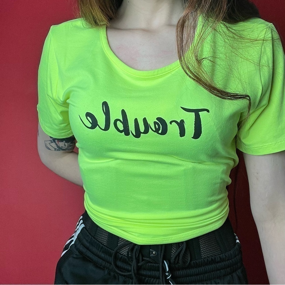 Neon green “trouble” tee 🖤💚​​​​​​​​​​​​​​​​​​​​​